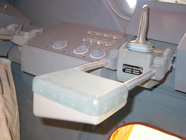 LEM, 2003-2007, 13'X11'X14', aluminum, steel, epoxy, wood, rubber, money
Commander's station, armrest, attitude controller